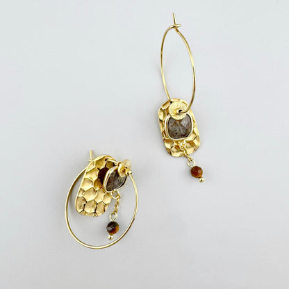 Earrings with tiger eye stone and hammered gold details.