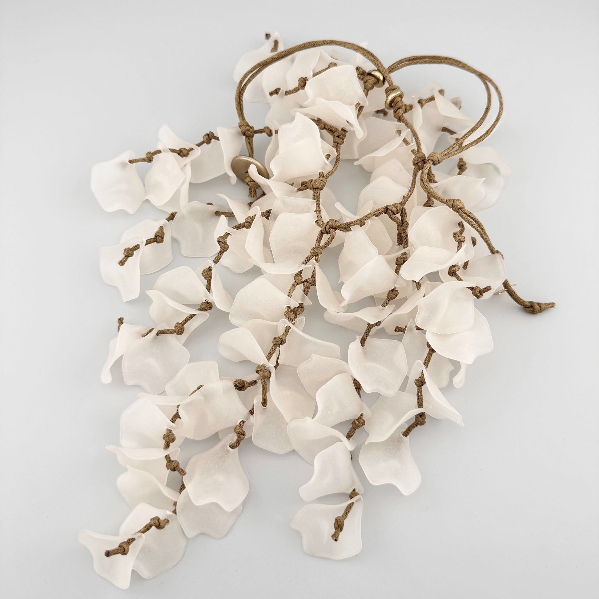 Necklace with white petal-shaped pendants, Spanish brand Sonata.