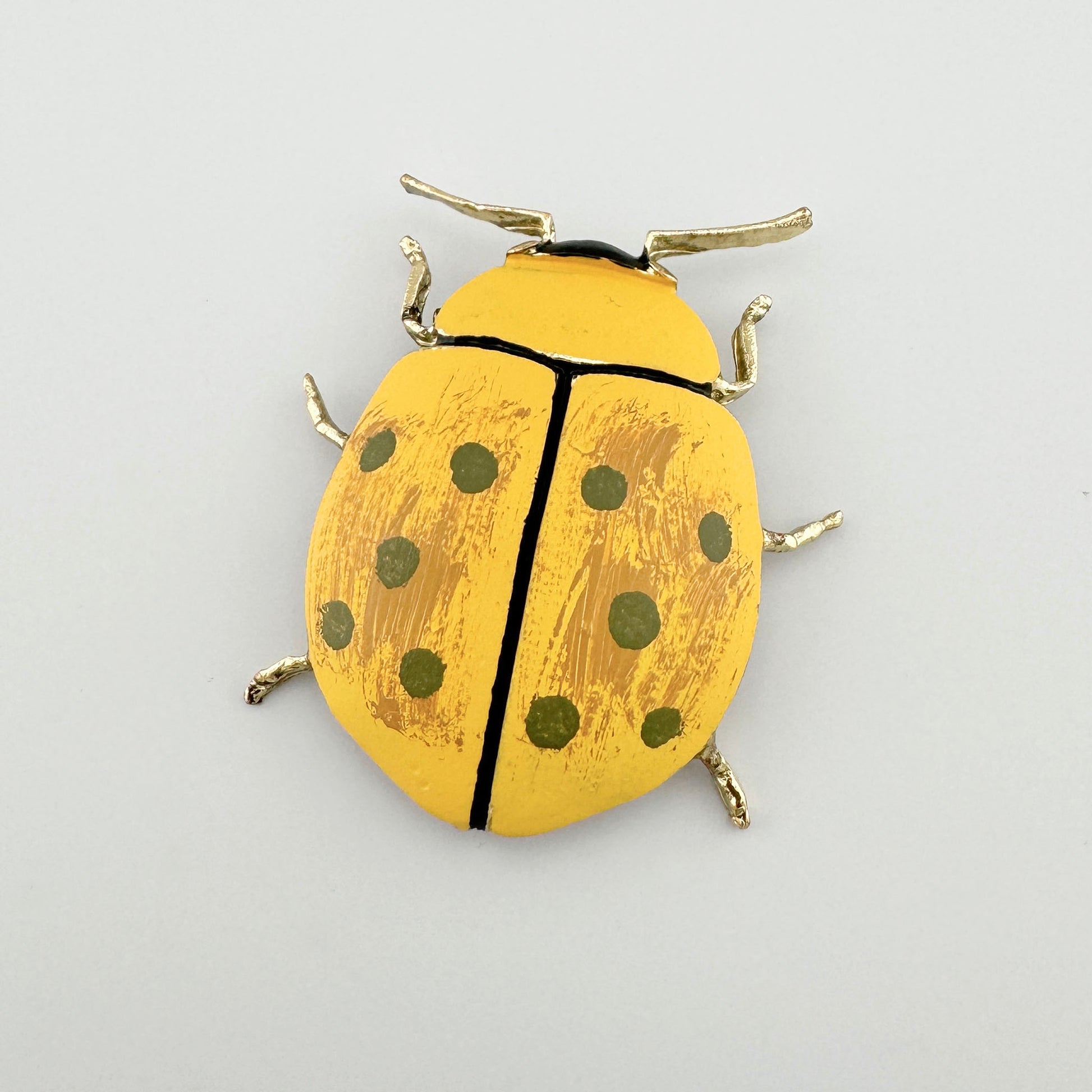 Brooch in the shape of a yellow beetle with black spots, Spanish brand Sonata.