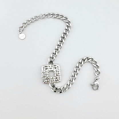 Pulsera de acero inoxidable con cadena y adorno calado en forma de cuadrado, marca francesa Ikita.