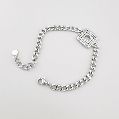 Edelstahl-Armband mit Kettengliedern und offen gearbeitetem quadratischem Element, französische Marke Ikita.