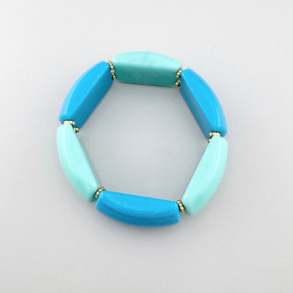 Pulsera elástica con cuentas en tonos turquesa y azul, marca francesa Ikita.