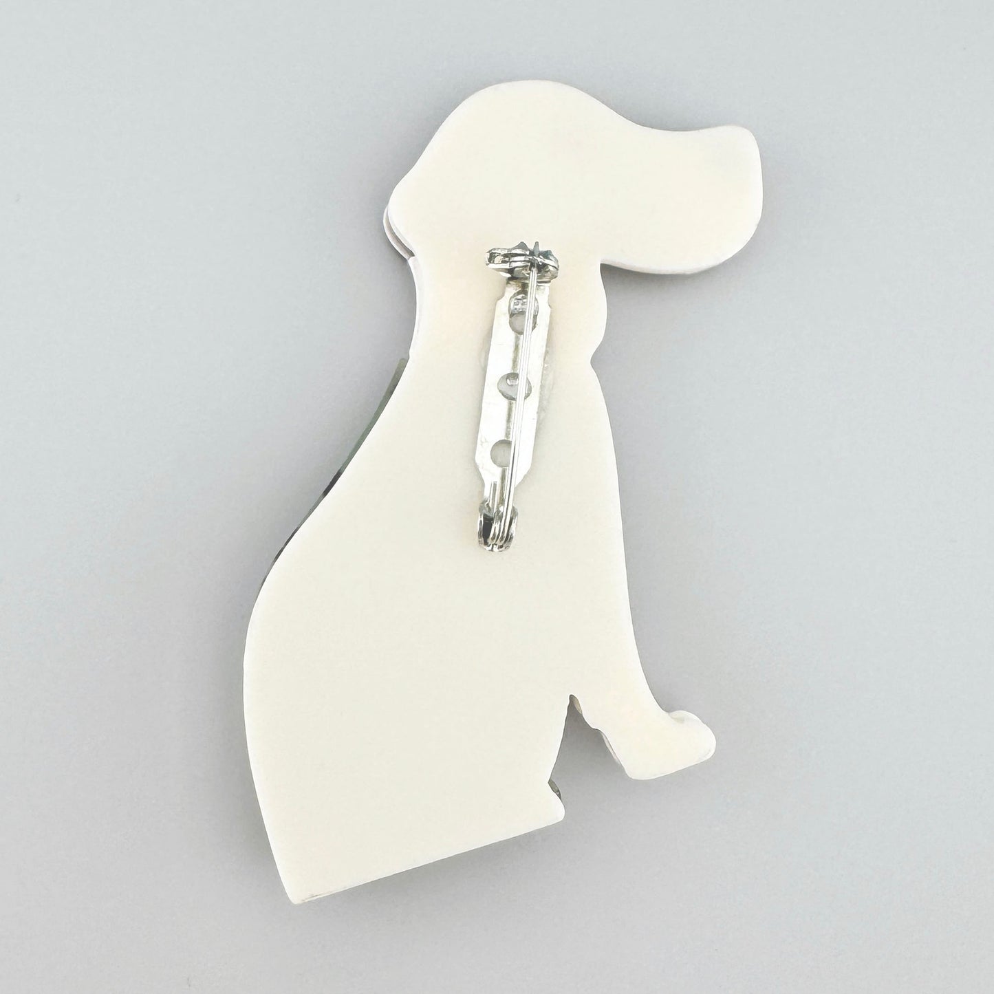 Acrylic dog-shaped brooch with a leopard print pattern and pastel details, Spanish brand Sonata.