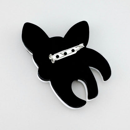 Acrylic brooch shaped like a black-and-white dog with striking details, Spanish brand Sonata.