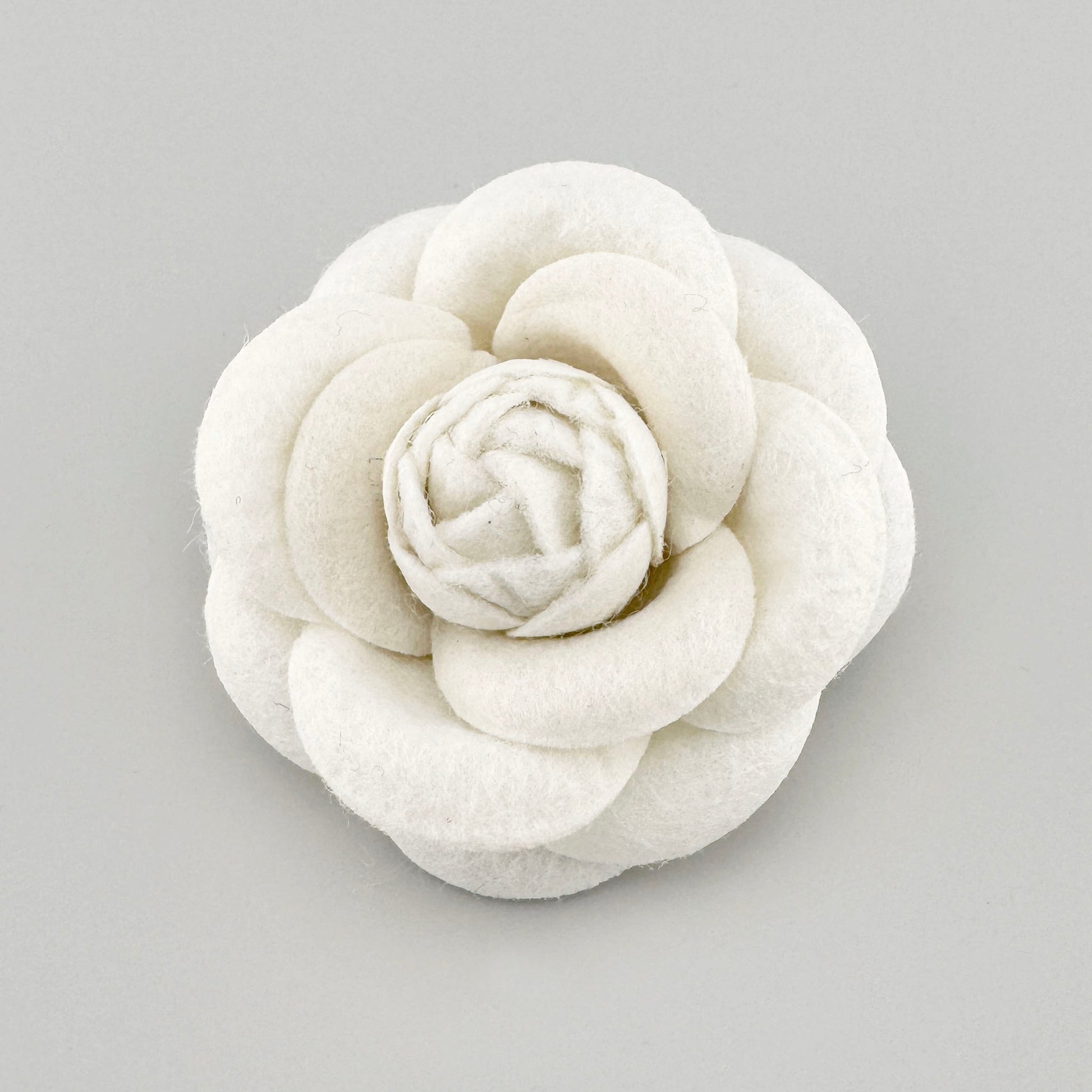 White felt brooch in the shape of a three-dimensional flower, Spanish brand Sonata.