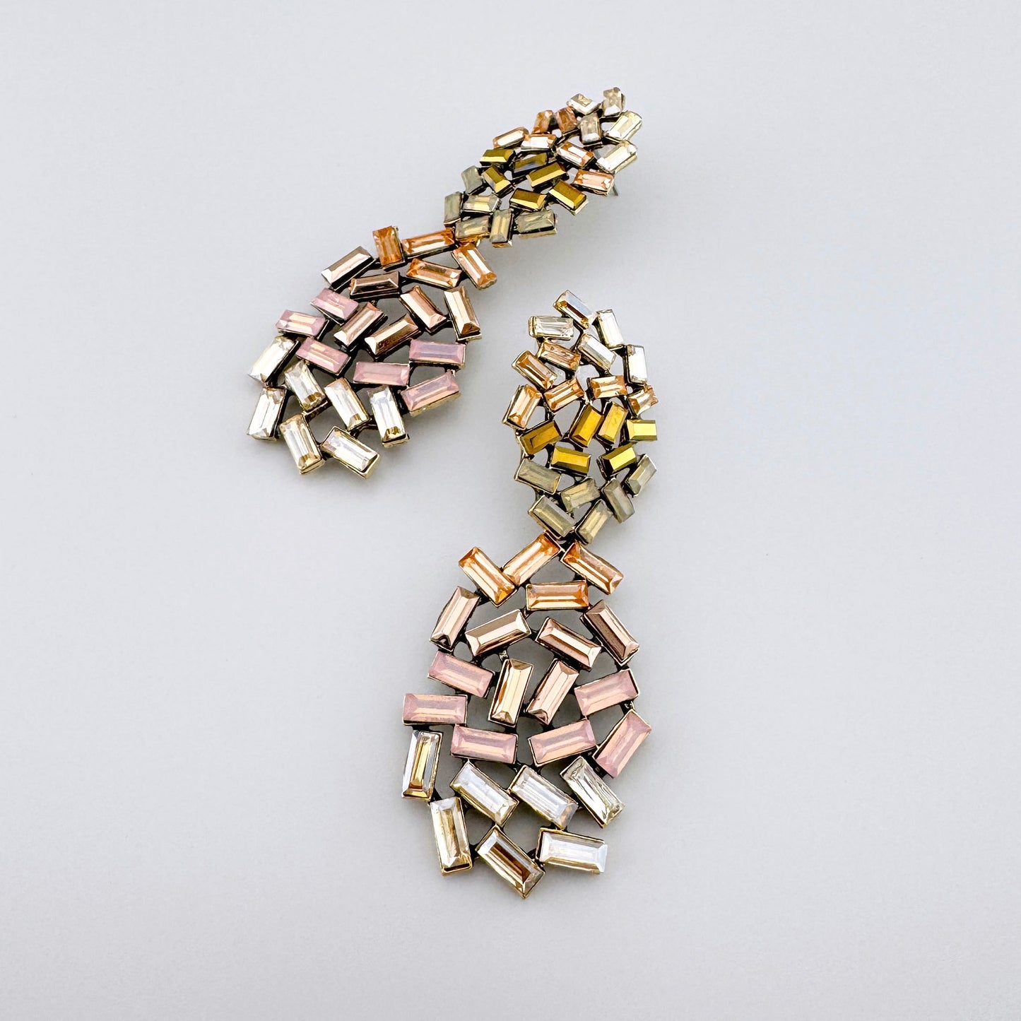 Stylish earrings with rectangular crystals in shades of pink and gold, by Spanish brand Sonata.