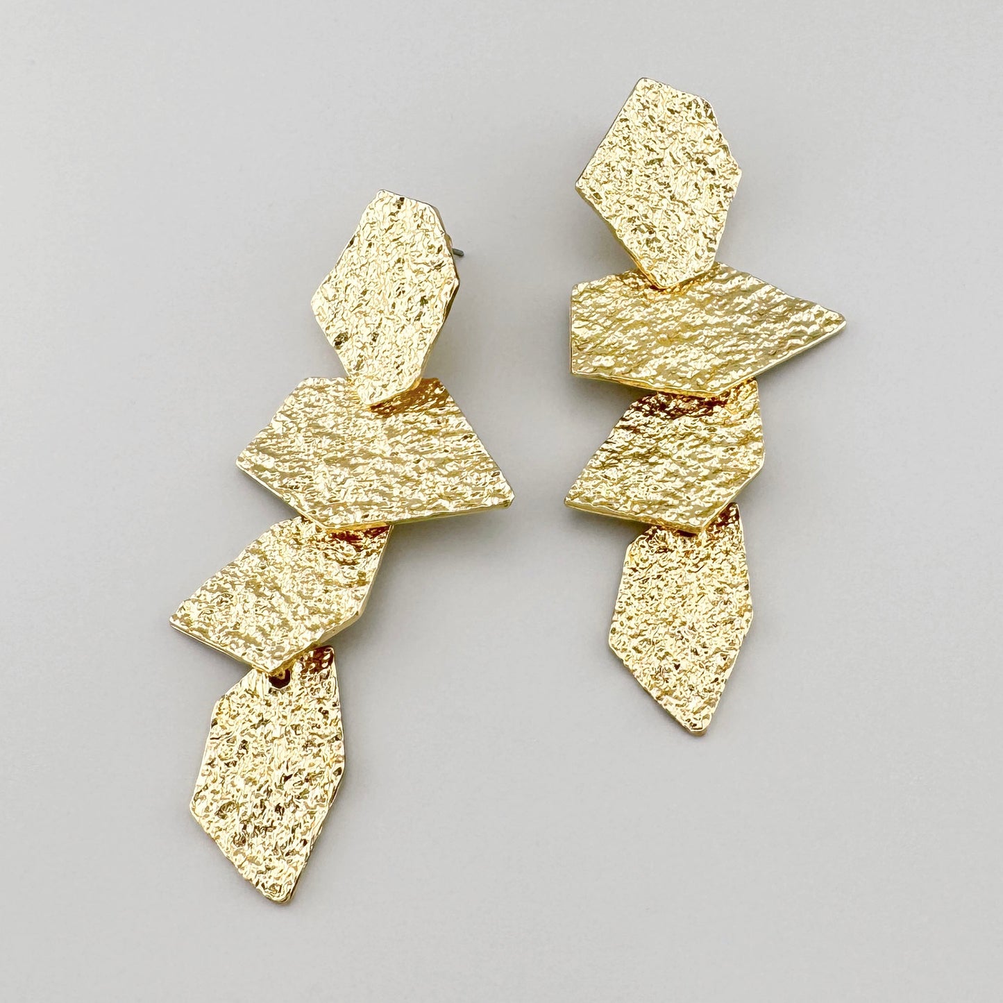 Gold earrings in a geometric shape, Spanish brand Sonata.