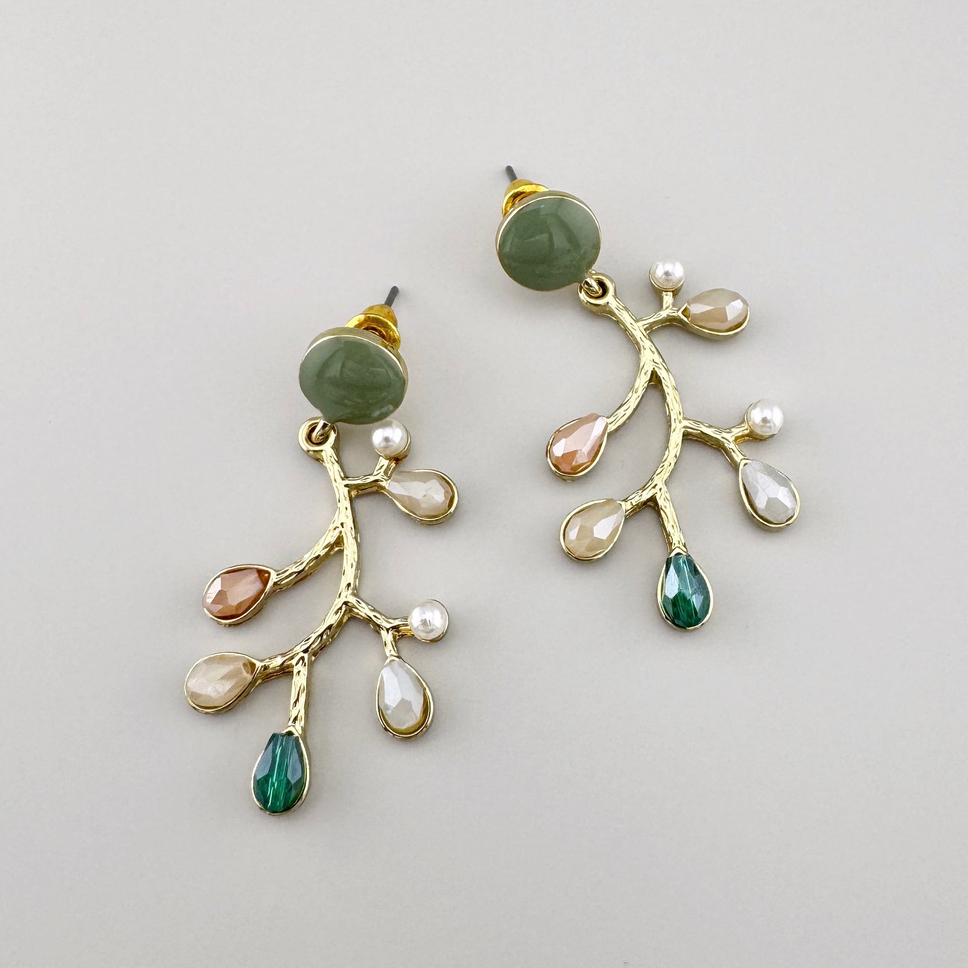 Earrings in the shape of a branch, adorned with colorful stones and artificial pearls, Spanish brand Sonata.