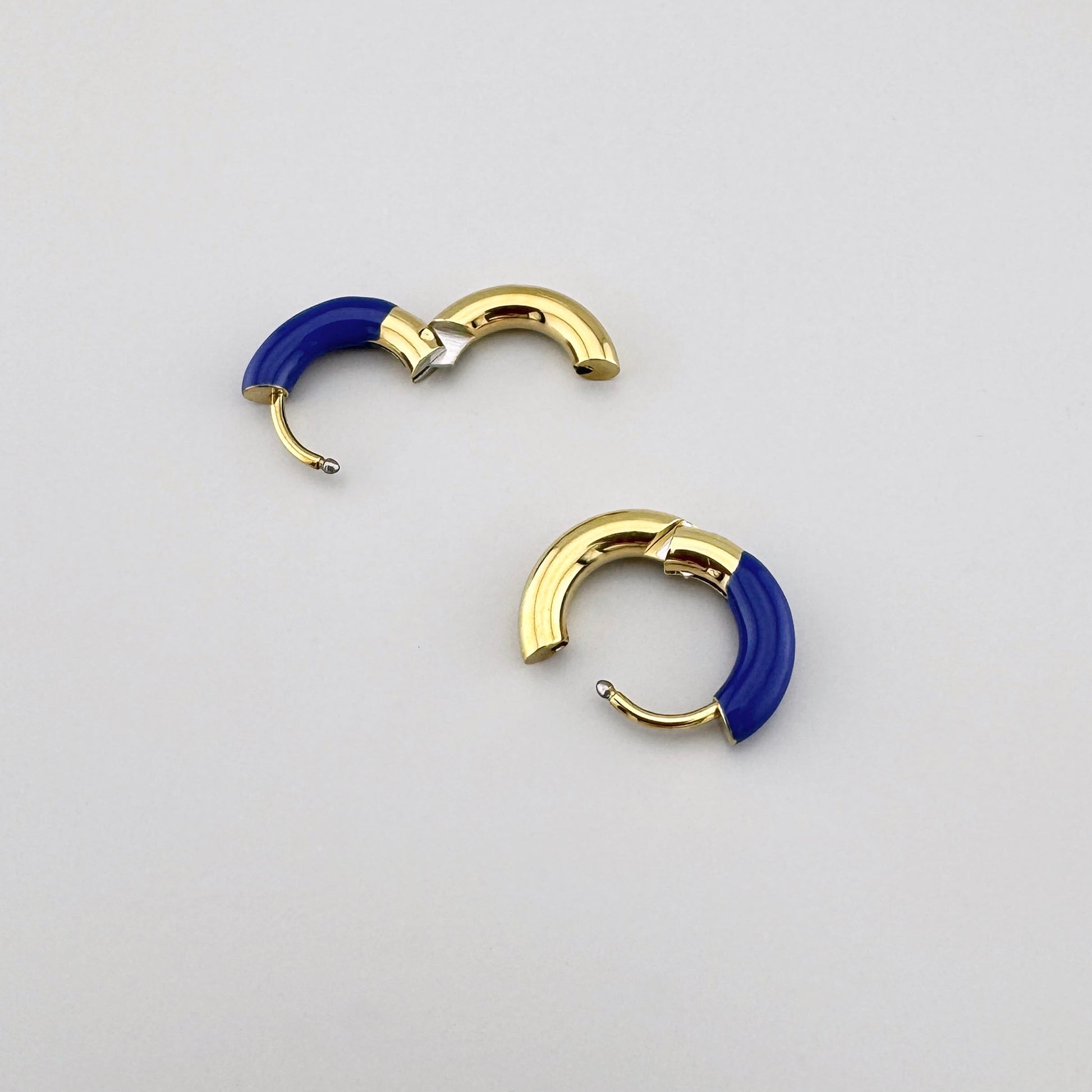 Gold hoop earrings with blue enamel, French brand Ikita.