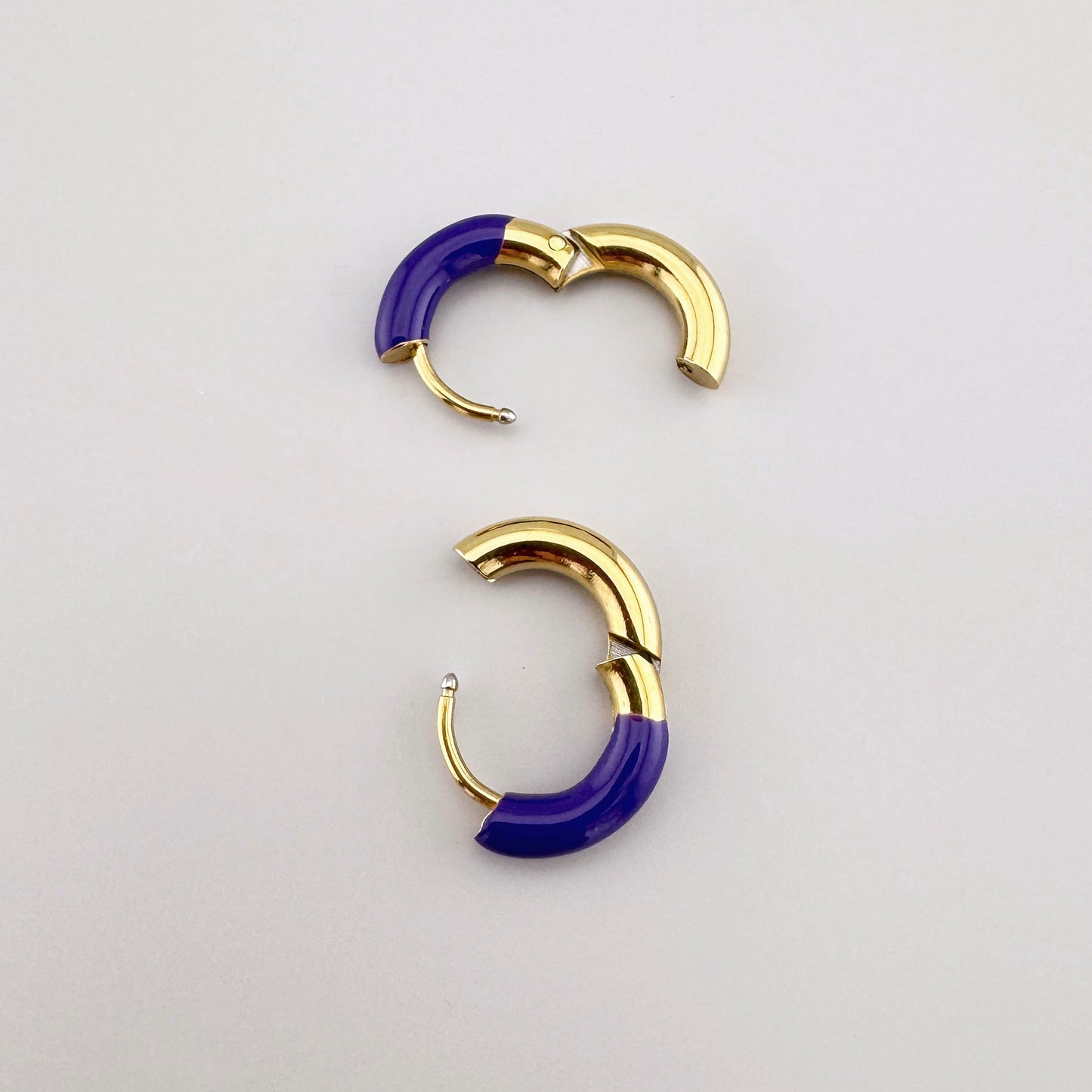 Gold hoop earrings with purple enamel, French brand Ikita.