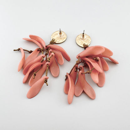 Peach-colored earrings resembling a cascade of petals, made from lightweight material. Brand Sonata.