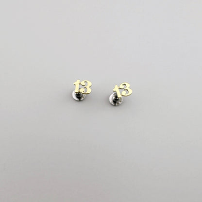 Earrings shaped like the number 13, by American brand Fossil.