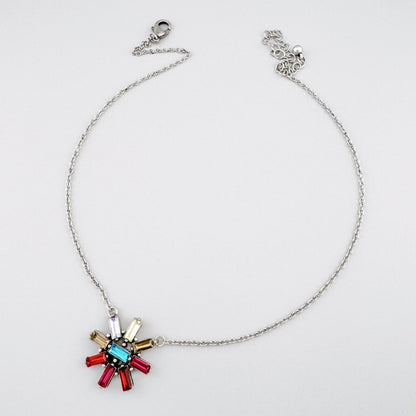 Elegant necklace featuring a colorful rosette-shaped pendant with crystals.