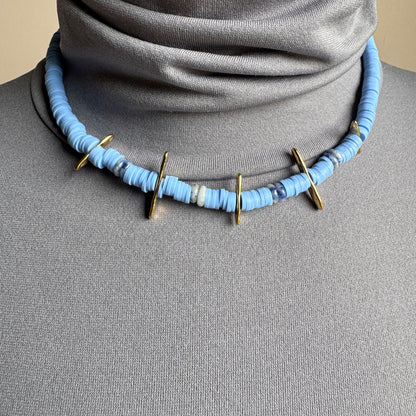 Choker necklace with blue polymer discs and sodalite stones, accented with gold details, French brand Ikita.