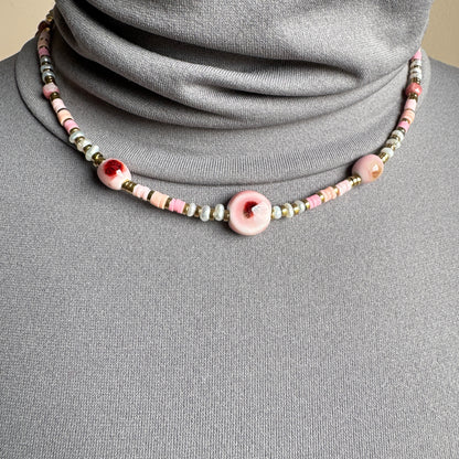 Necklace with ceramic beads in soft pink and beige tones, French brand Ikita.