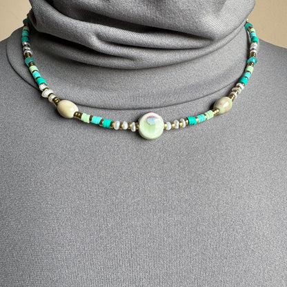 Necklace with pastel ceramic beads in mint, turquoise, and blue tones, French brand Ikita.