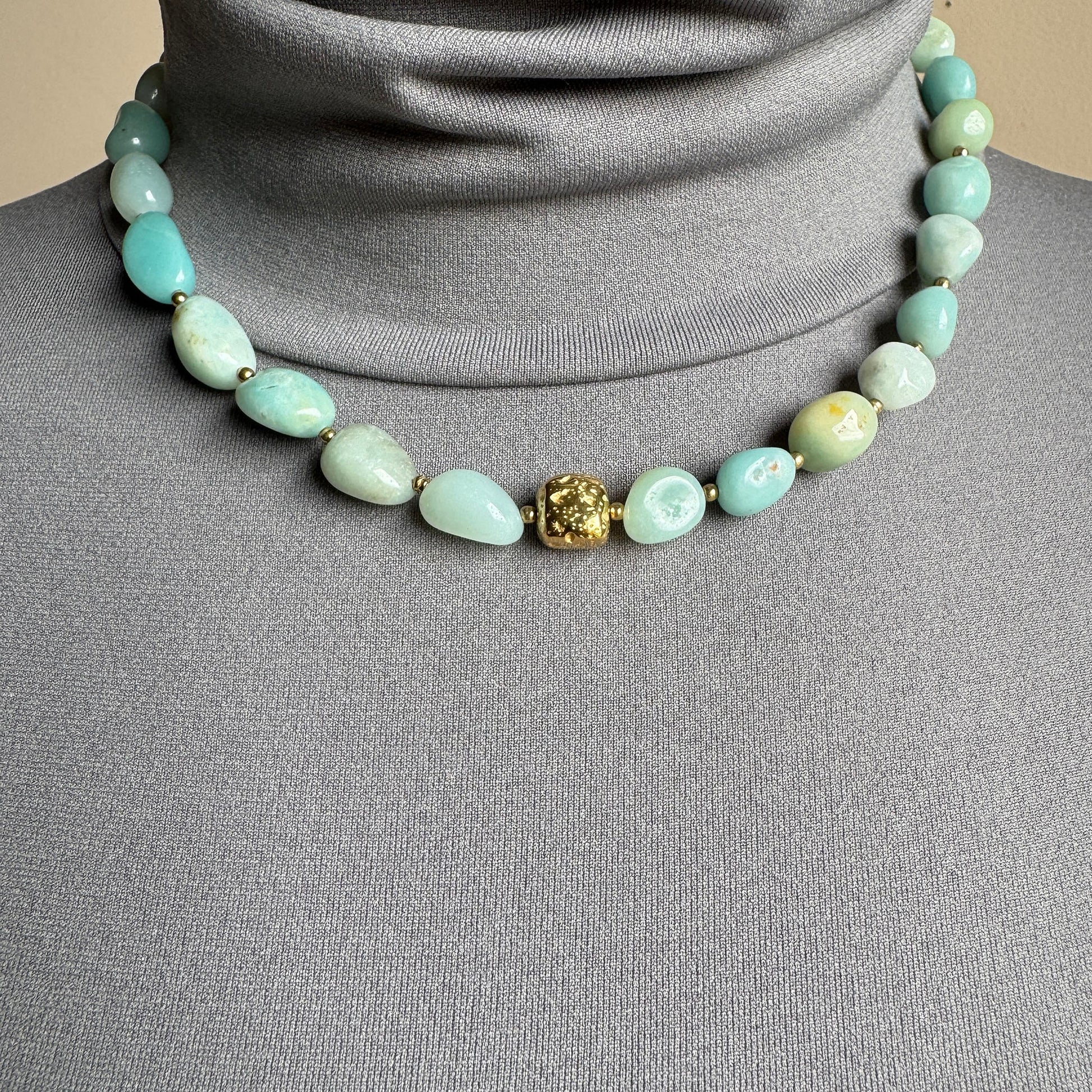 Necklace with blue amazonite stones and gold spacers, French brand Ikita.