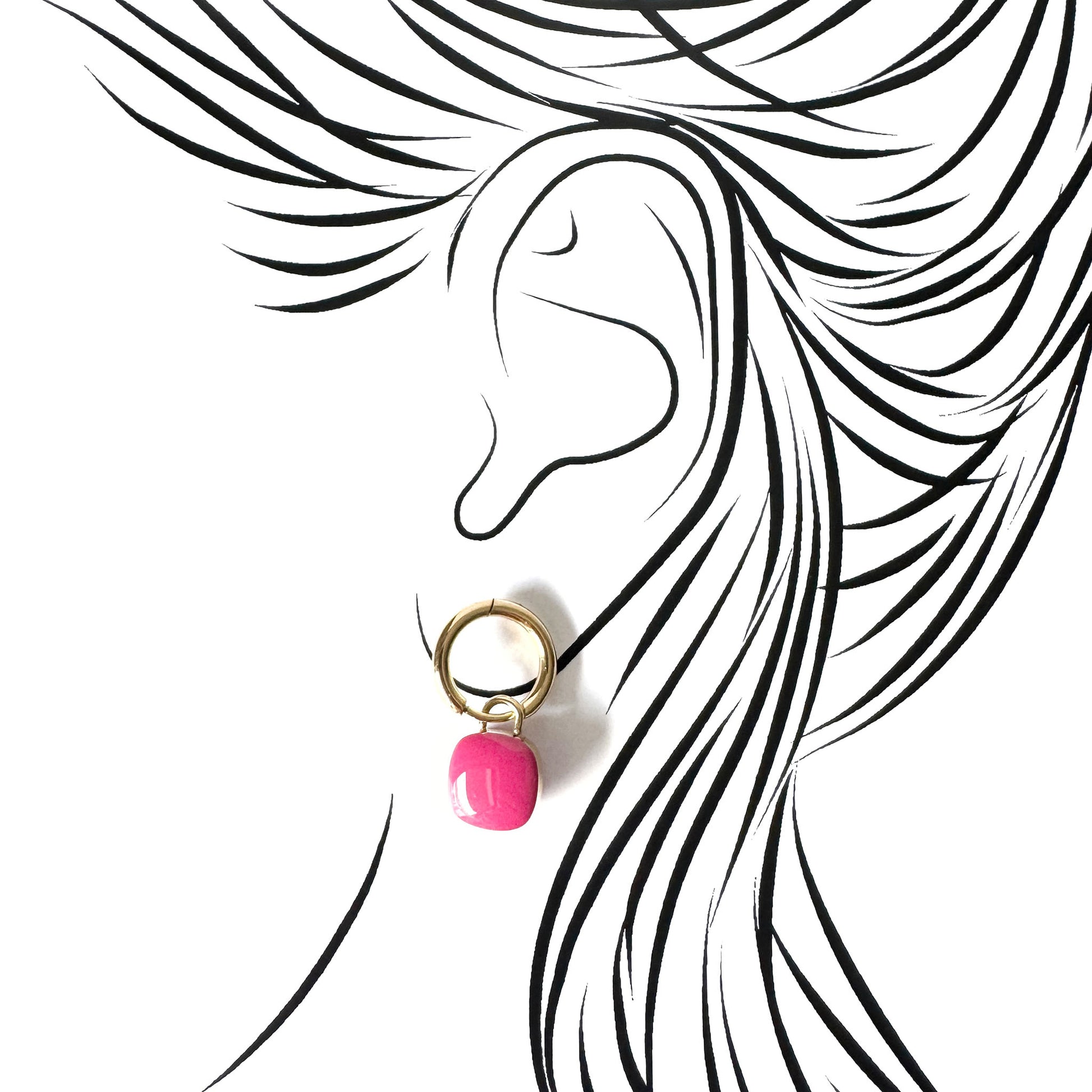 Gold hoop earrings with glossy pink enamel charms, French brand Cannelle.