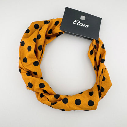 Headband in mustard color with black polka dots, brand Etam.