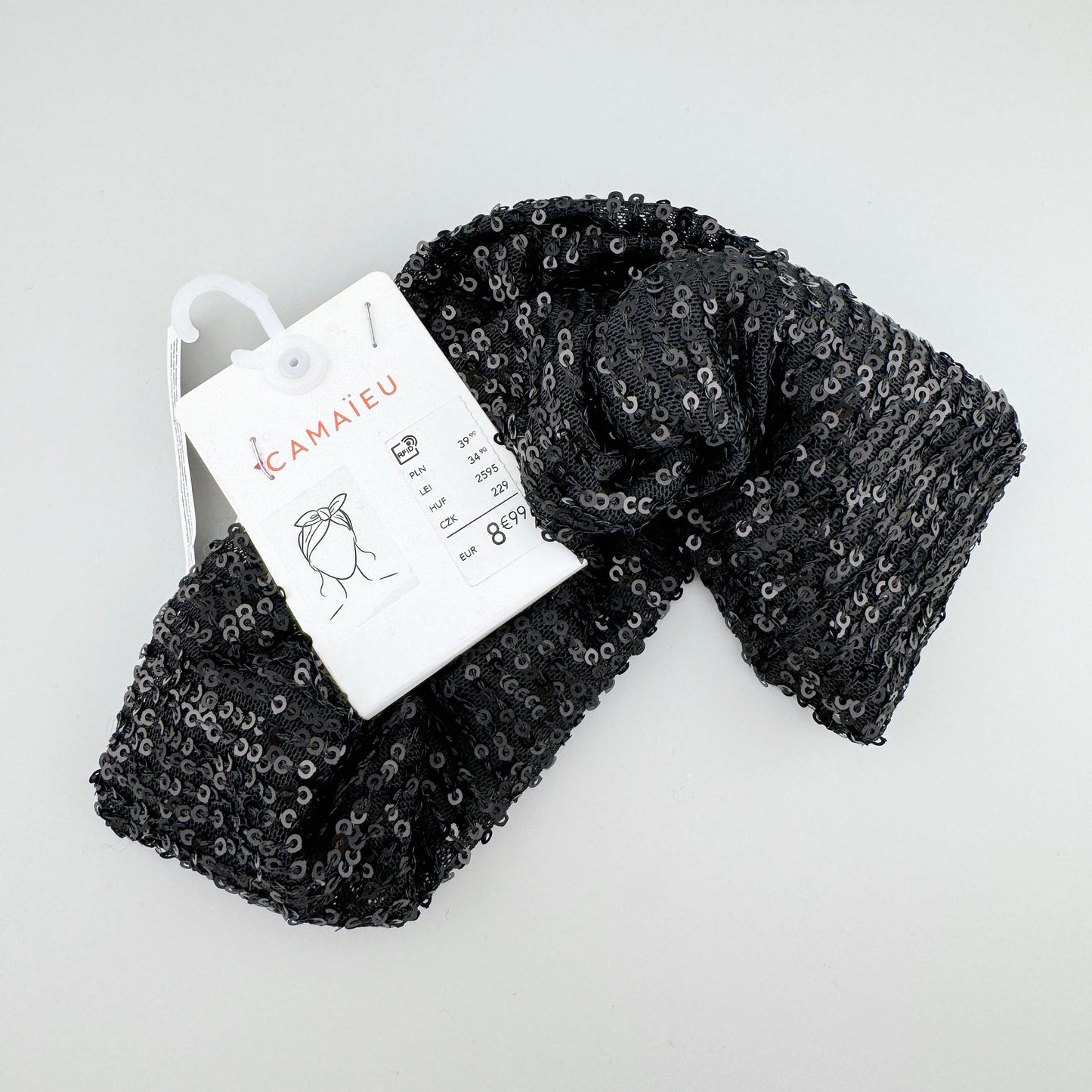 Headband made of black fabric covered with sequins, French brand Camaïeu.