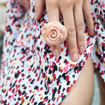 Plastic rose-shaped ring in a soft pink color, Spanish brand Sonata.