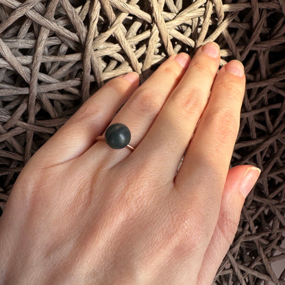 Adjustable Pilgrim ring with deep green stone and matte finish