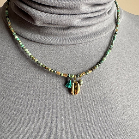 African turquoise necklace IRL worn close to the neck with faceted stones and a gold shell charm