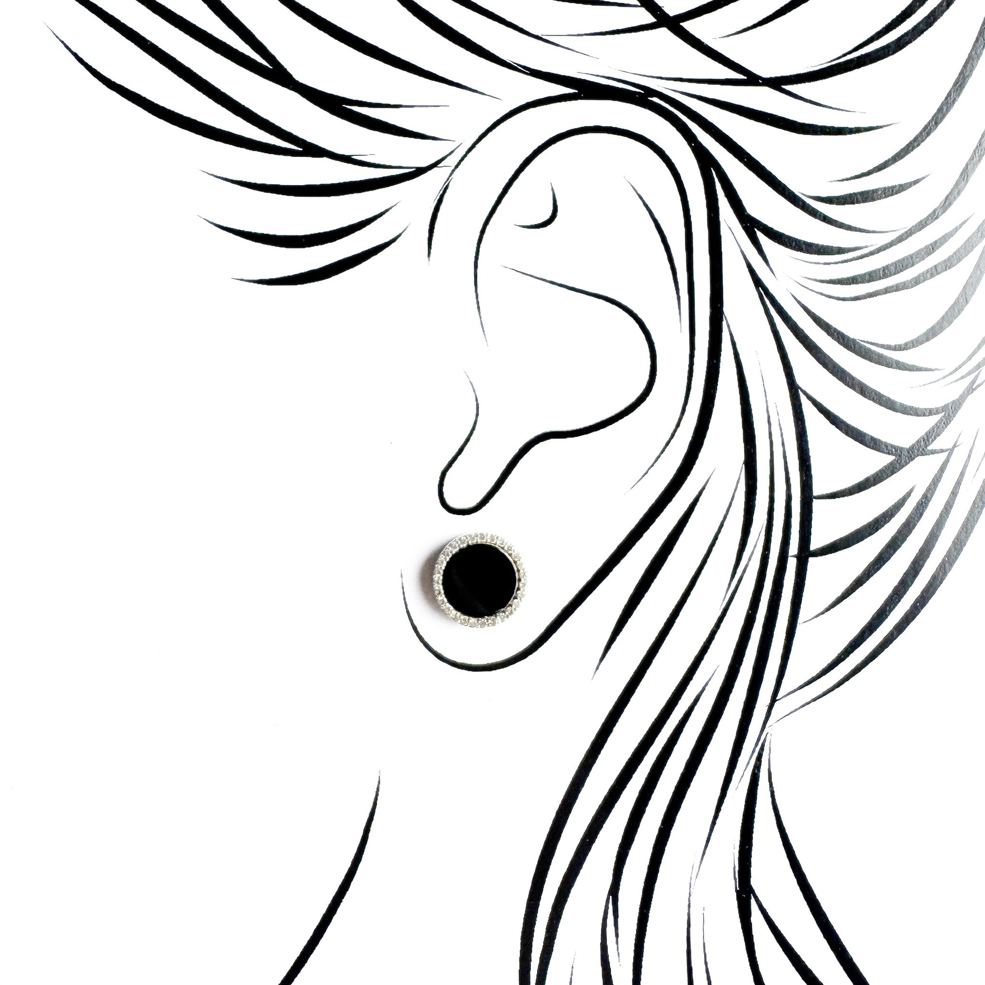 Silver black oval stud earrings Universe worn on the ear with a polished setting