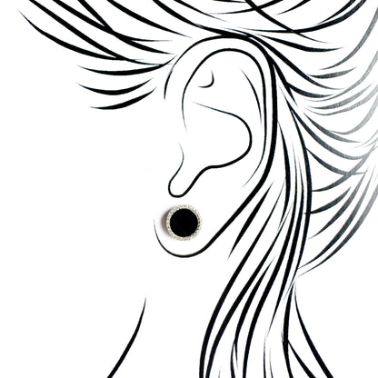 Silver black oval stud earrings Universe worn on the ear with a polished setting
