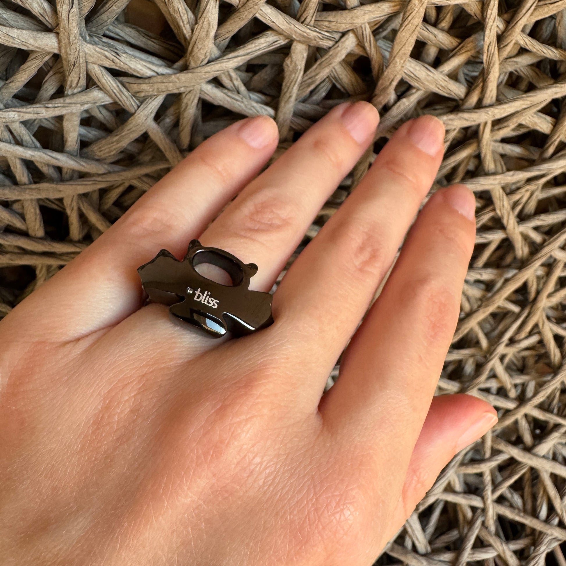 Black stainless steel ring by Bliss Gioielli worn on hand