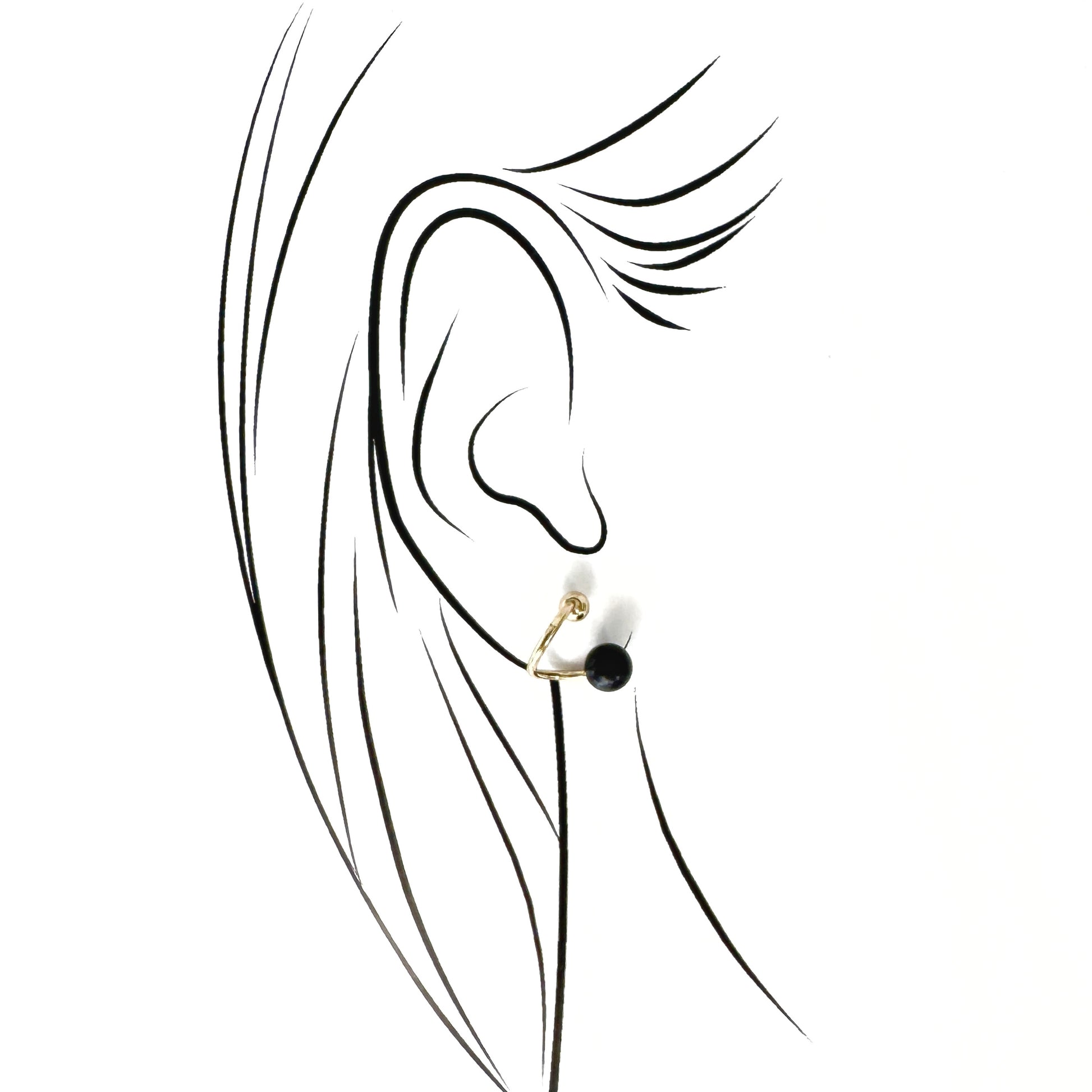 Polished gold-tone studs with a deep black stone and a spiral silhouette by Pilgrim, refined for daily wear