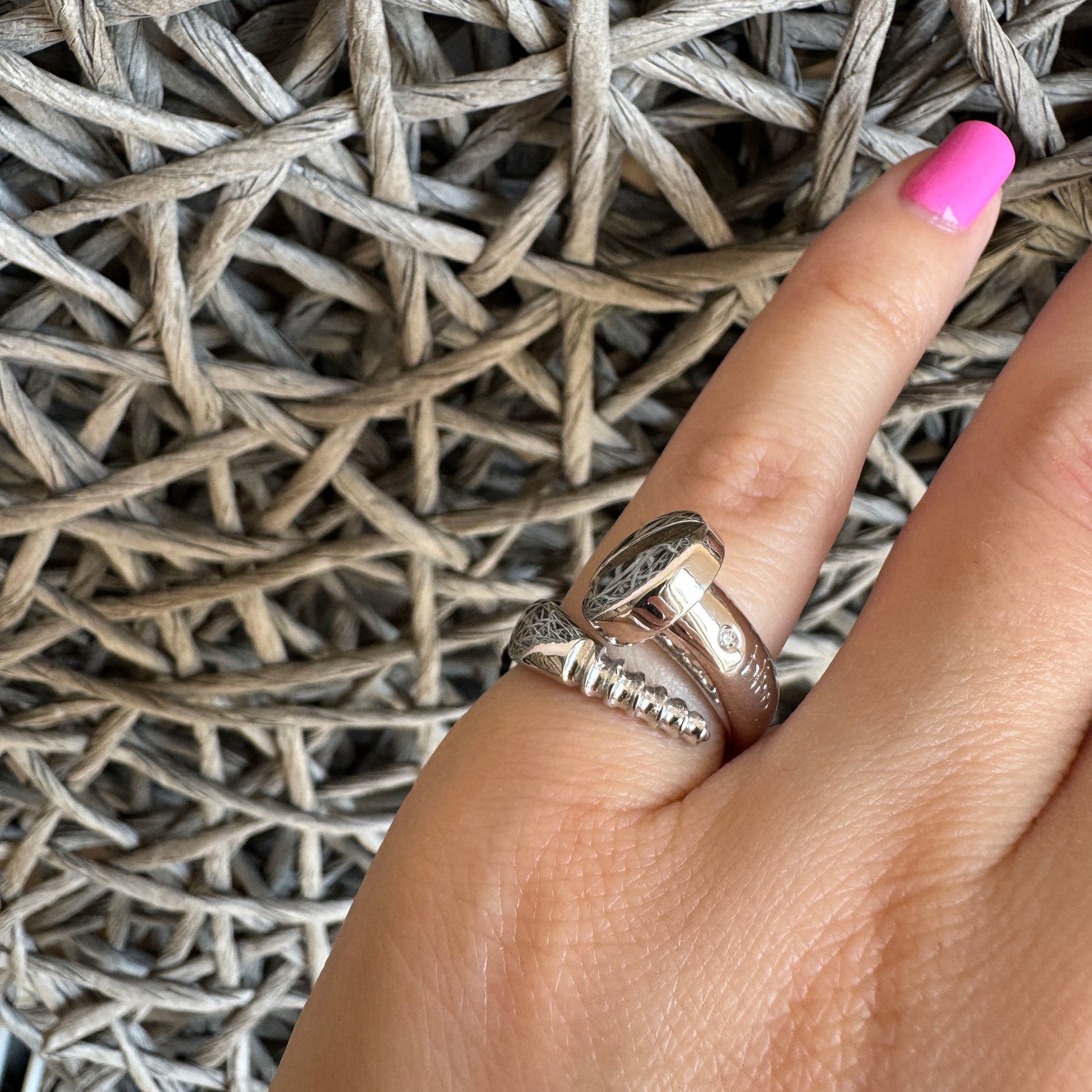 Bliss Gioielli silver screw-motif ring with a small natural diamond, clean industrial lines