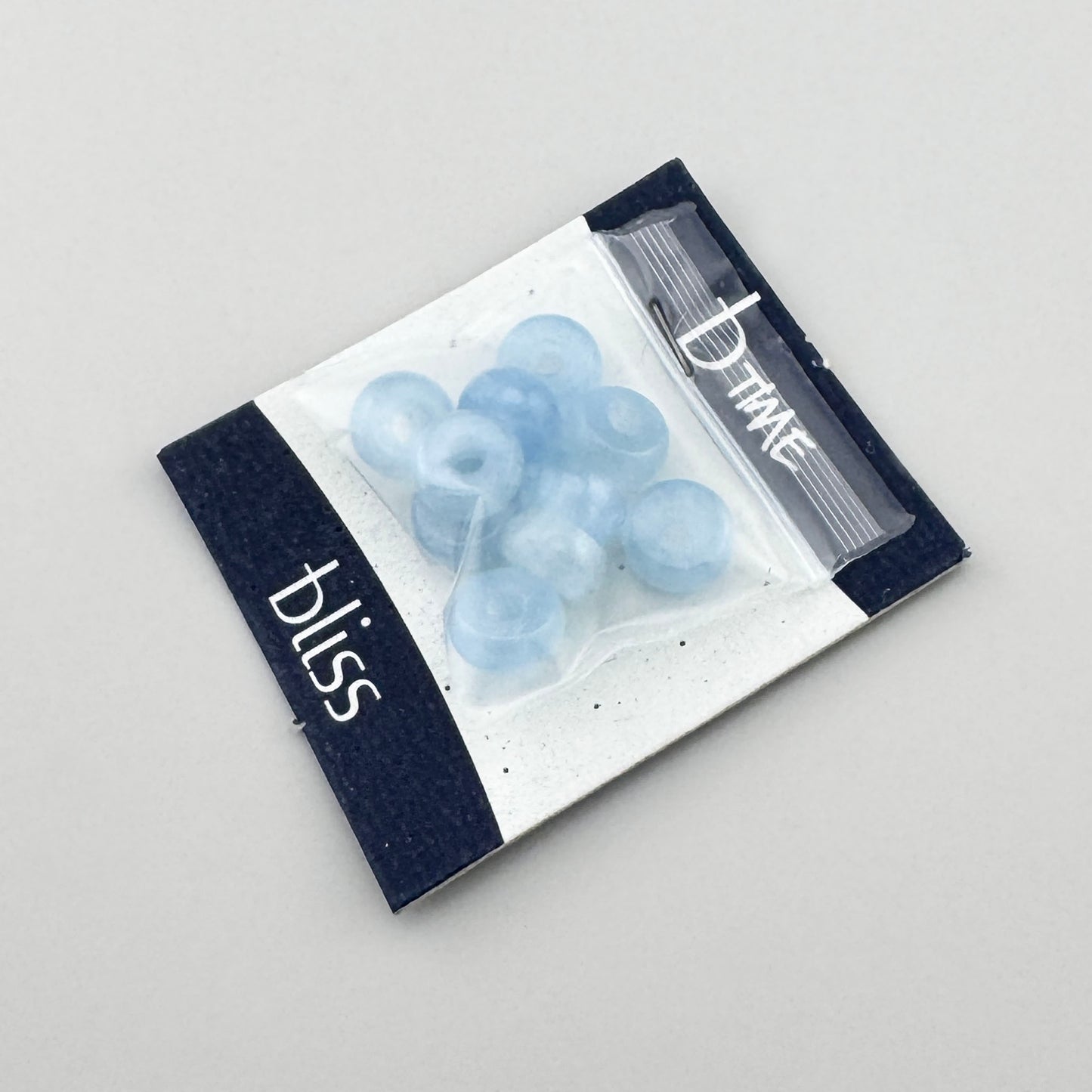 Blue aquamarine beads Bliss Gioielli in a soft milky shade and rounded donut shape