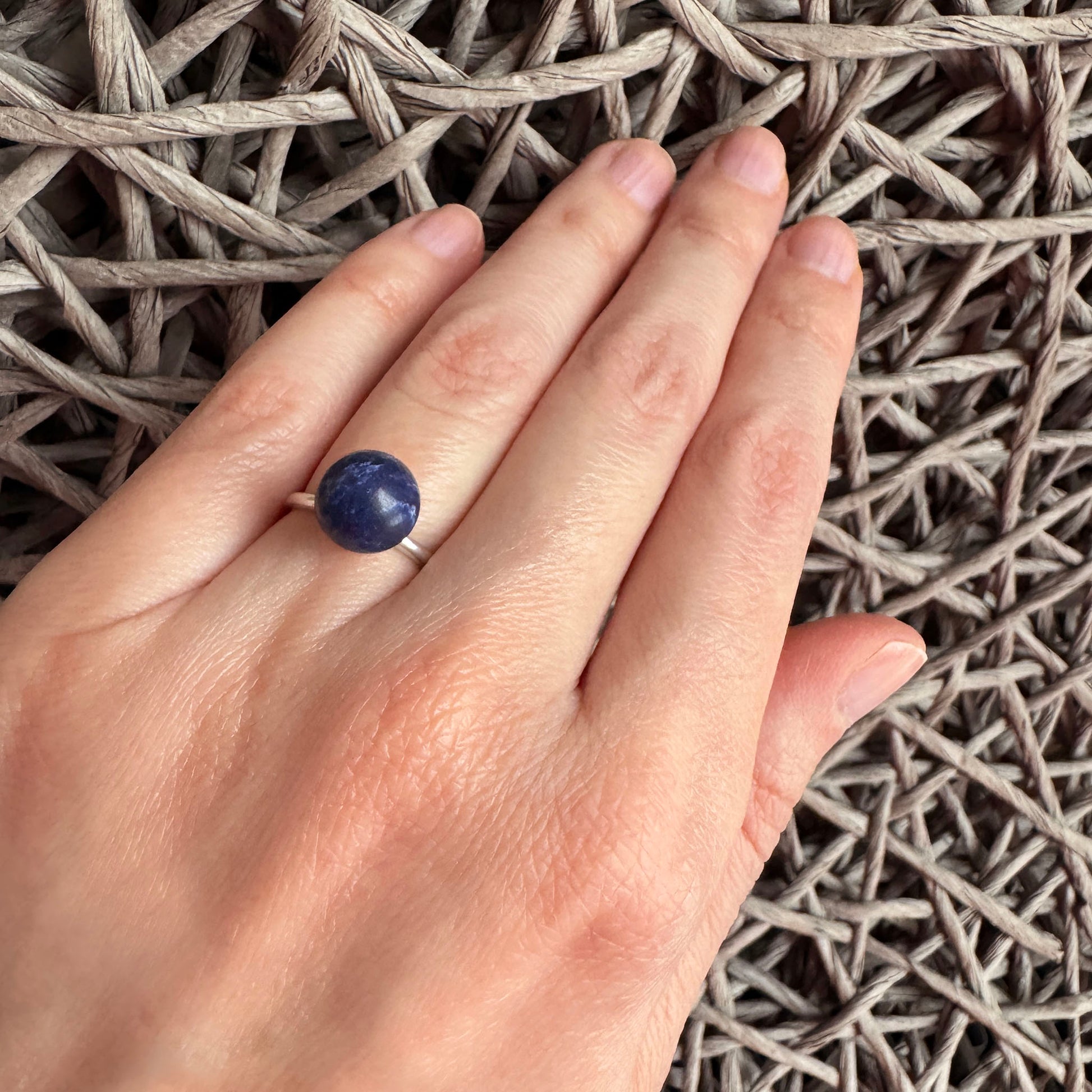 Blue stone ring Pilgrim worn on the hand with a slim silver-tone band
