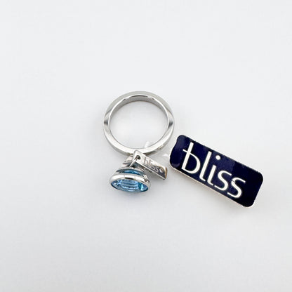 Bague Bliss Gioielli avec topaze bleue en serti sûr, détail diamant discret
