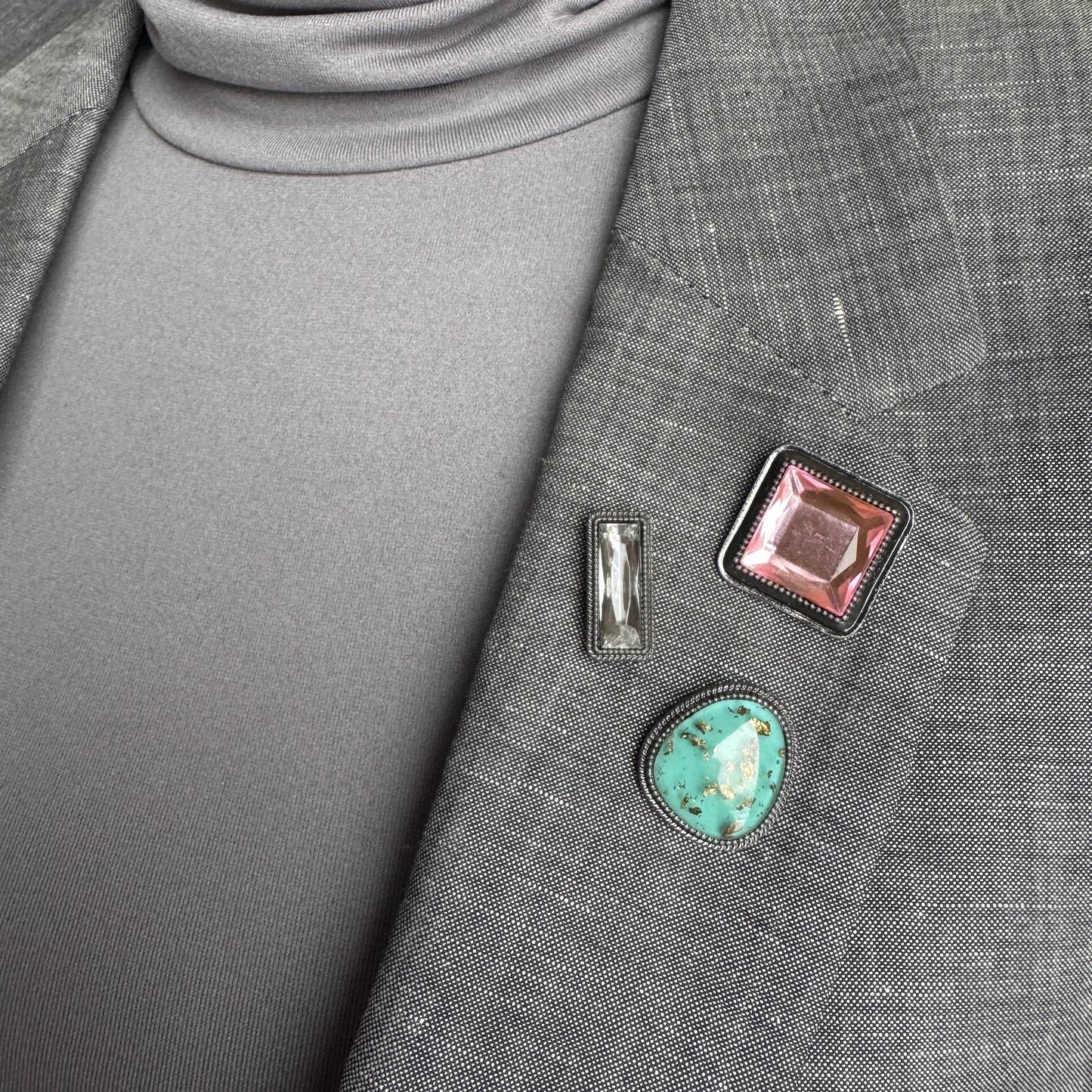 Set of three Sonata brooches worn on a blazer with geometric vintage-inspired shapes