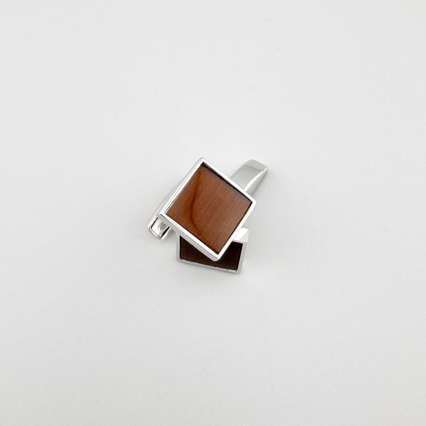 Silver cufflinks Bliss Gioielli with a brown stone and a clean geometric shape