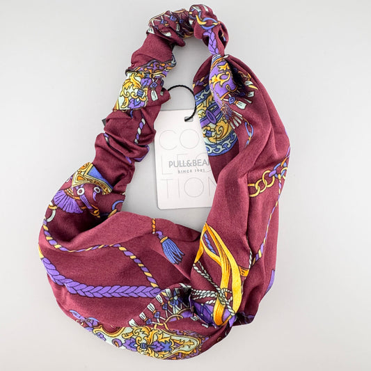 Burgundy Pull&Bear headband folded to show its chain print, baroque details, and satin sheen
