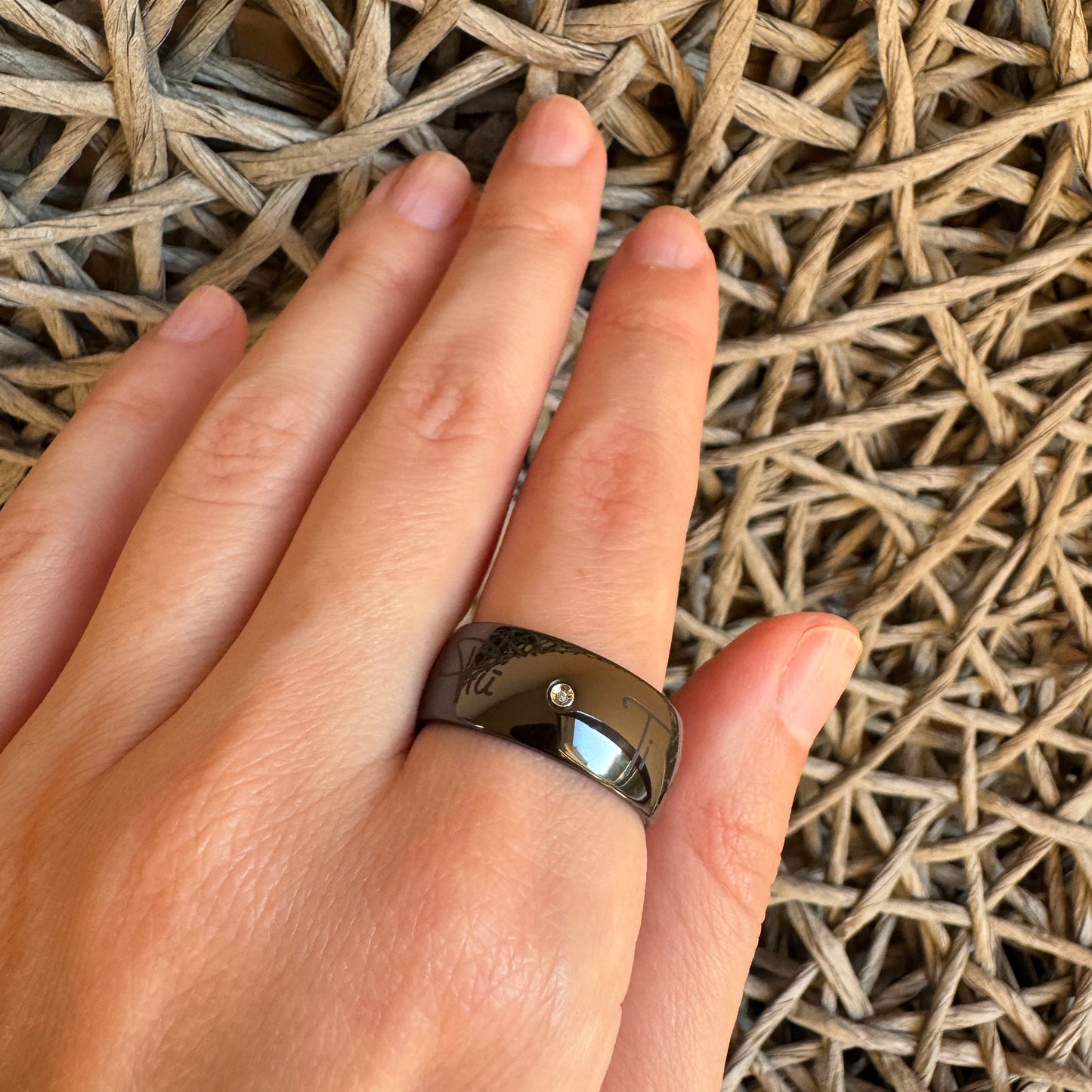 Black ceramic ring by Bliss Gioielli worn on hand