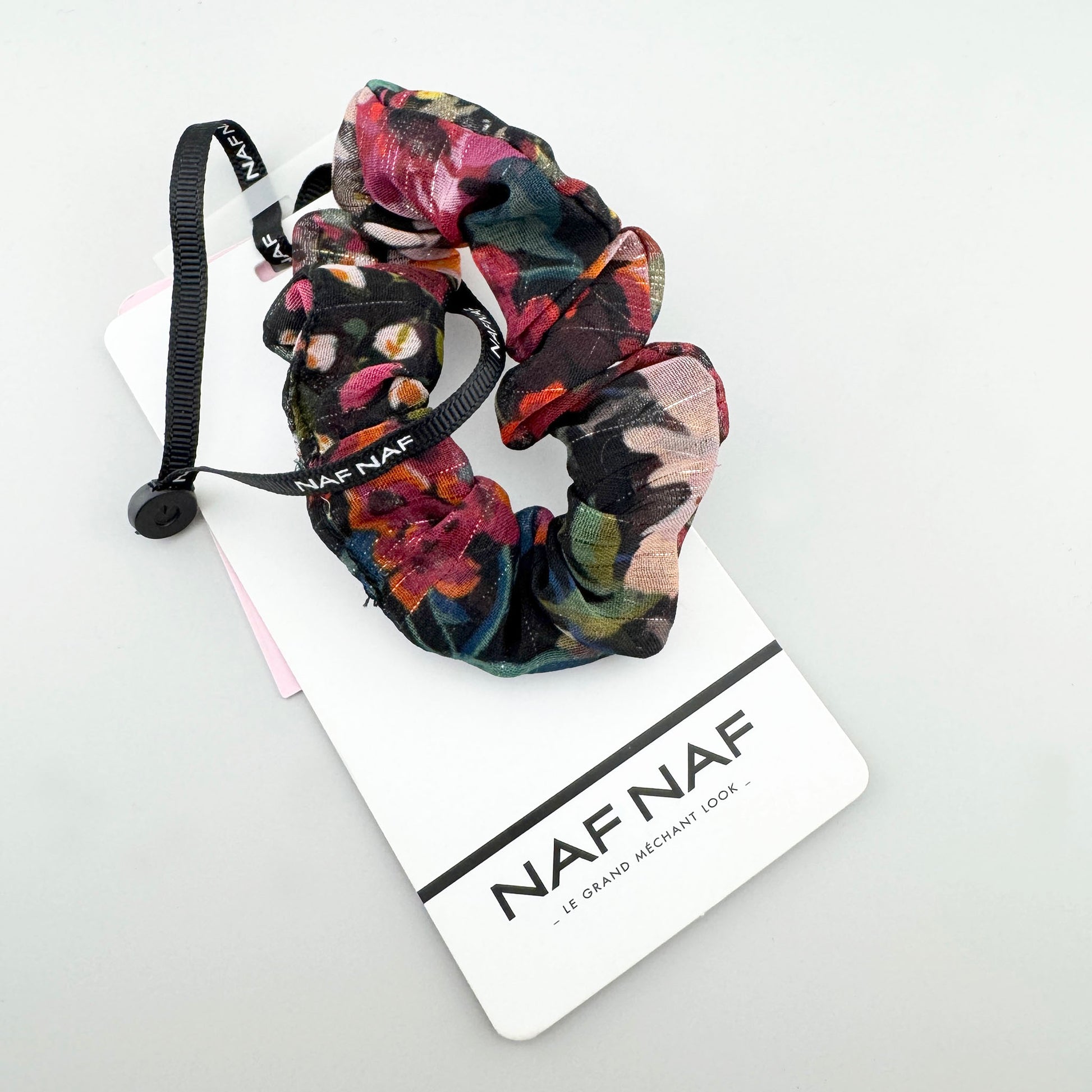 Colorful floral hair tie Naf Naf with a black ribbon and soft sheen