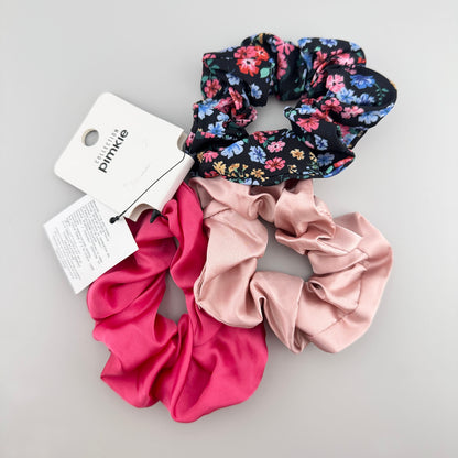 Colorful scrunchie set with floral navy print, blush pink, and vivid fuchsia