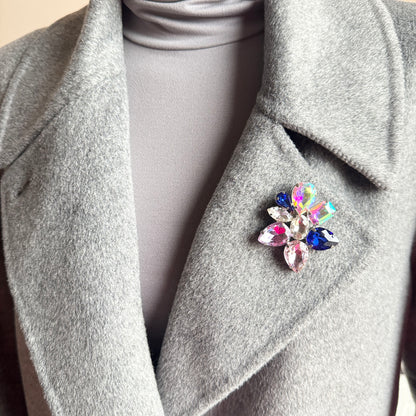 Crystal flower brooch Sonata worn on a coat with vivid multicolor sparkle