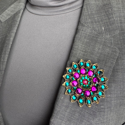 Colorful crystal brooch Sonata worn on a blazer with a radiant geometric arrangement