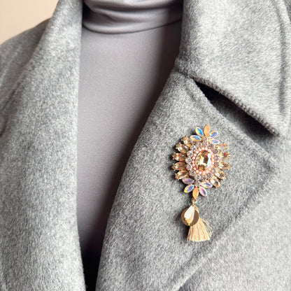 Crystal flower brooch Sonata worn on a blazer with a soft tassel detail