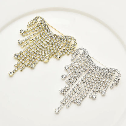 Broche à franges Maravillas avec cascade de cristaux et reflet argenté