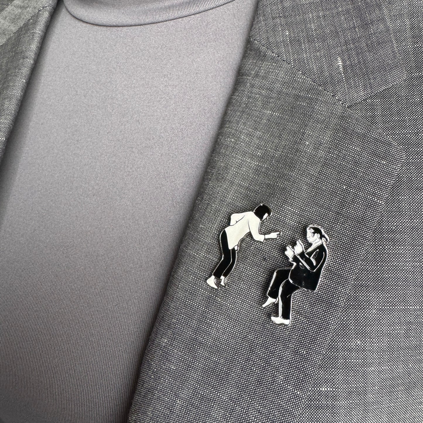 Dance duo pin set Sonata worn on a blazer in a graphic black-and-white style