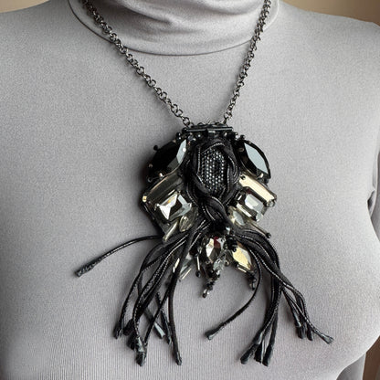 Artistic fringe brooch Sonata worn as a necklace with dark crystals and textile tassels