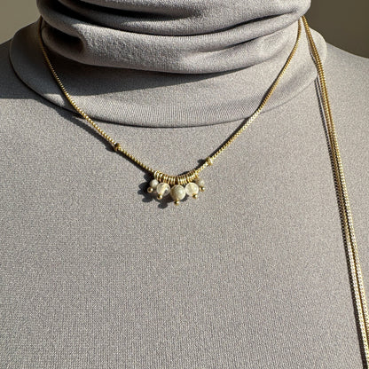 Elegant Pilgrim necklace with rose quartz and gold details worn as double choker