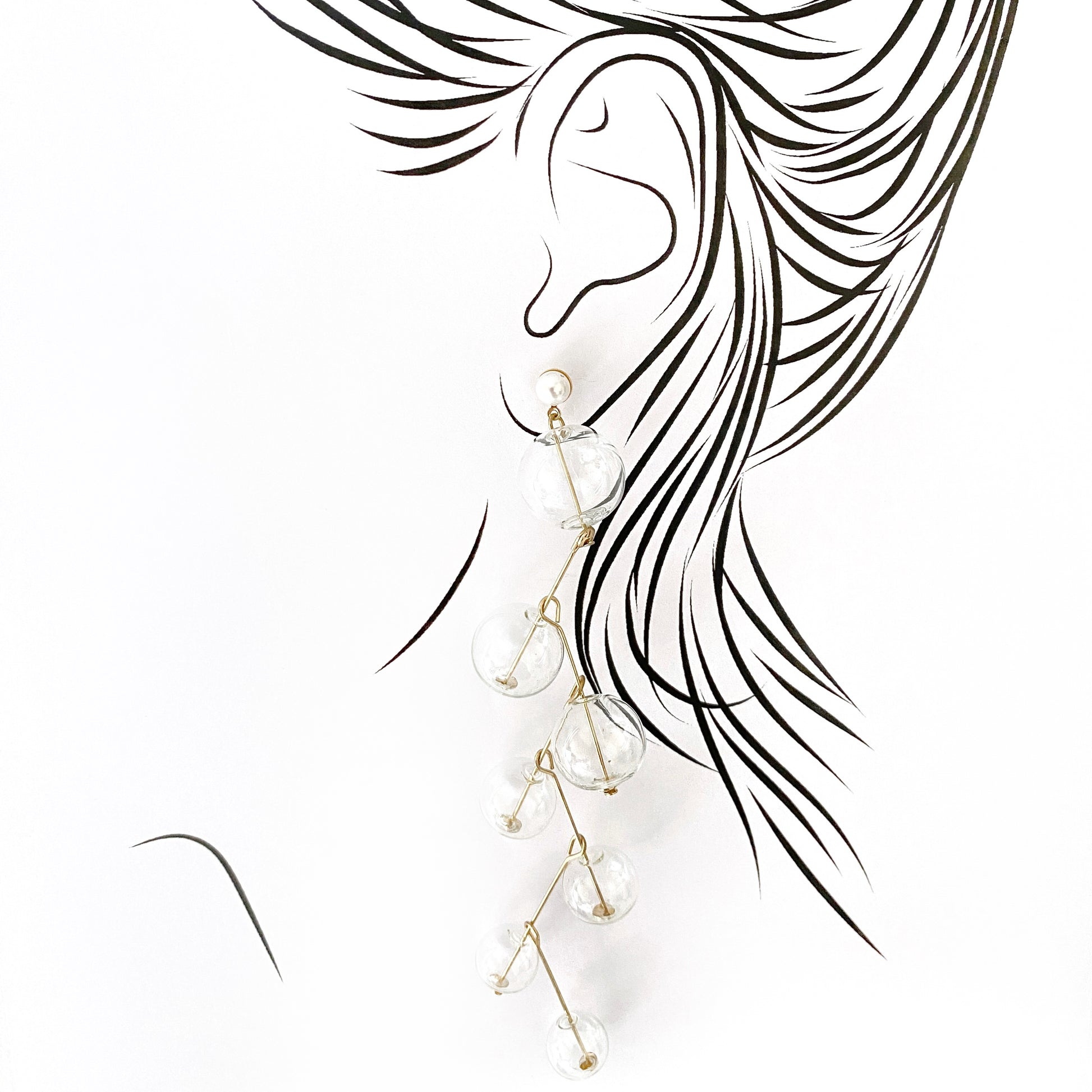 Elegant long earrings with clear glass beads and golden pins