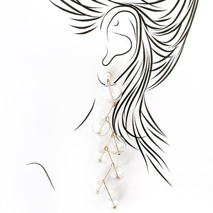 Elegant long earrings with clear glass beads and golden pins